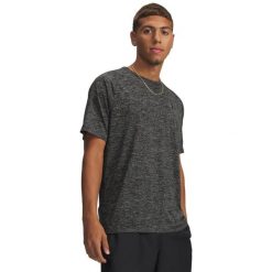 Koszulka fitness Under Armour. Koszulki sportowe damskie Under Armour, l, bez wzorów, z materiału, bez kołnierzyka, bez ramiączek, na fitness i siłownię. Za 129.99 zł.