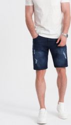Ombre Krótkie spodenki męskie jeansowe z dziurami ciemnoniebieskie V3 OM-SRDS-0146 S. Niebieskie szorty męskie Ombre, m, bez wzorów, z jeansu. Za 59.99 zł.