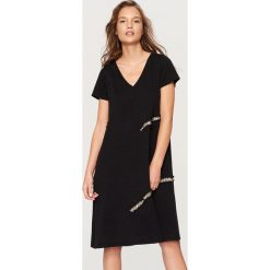 Sukienka oversize - Czarny. Sukienki damskie marki Reserved. W wyprzedaży za 39.99 zł.