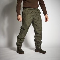 Spodnie wierzchnie Solognac 100 wodoodporne. Brązowe spodnie sportowe męskie SOLOGNAC, l, bez wzorów, z materiału, outdoorowe. Za 89.99 zł.