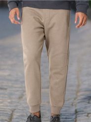 Spodnie dresowe jogger - beżowy. Brązowe spodnie sportowe męskie Sinsay, l, bez wzorów, z dresówki. W wyprzedaży za 15.99 zł.