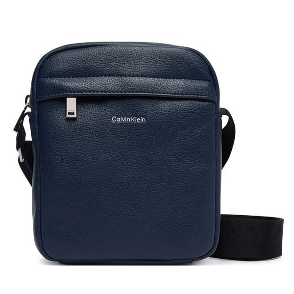 Saszetka Calvin Klein. Niebieskie saszetki męskie Calvin Klein, młodzieżowe, małe. Za 296.99 zł.