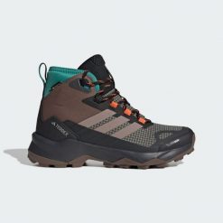 Buty trekkingowe Terrex Skychaser AX5 Mid GORE-TEX CLIMAWARM+. Brązowe trekkingi damskie Adidas, wspinaczkowe, climawarm (adidas). Za 419.40 zł.