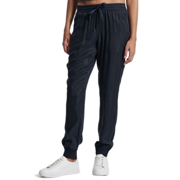 Spodnie turystyczne damskie Superdry Studios Supro Woven Jogger. Niebieskie spodnie sportowe damskie Superdry., s, bez wzorów, z wiskozy, trekkingowe. W wyprzedaży za 193.00 zł.