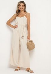Jasnobeżowy Kombinezon na Cienkich Regulowanych Ramiączkach ze Ściągaczem w Talii Huetta. Brązowe sukienki damskie Born2be, na spotkanie biznesowe, na lato, l, bez wzorów, z jeansu, eleganckie, bez kołnierzyka, bez ramiączek. Za 89.99 zł.