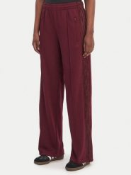 Adidas Spodnie dresowe Firebird Lace KC6445 Bordowy Loose Fit. Czerwone spodnie dresowe damskie Adidas, xl, bez wzorów, z dresówki. Za 319.99 zł.