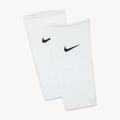 Rękawy do ochraniaczy piłkarskich Nike Guard Lock. Białe legginsy sportowe męskie Nike, l, bez wzorów, do piłki nożnej. Za 45.99 zł.
