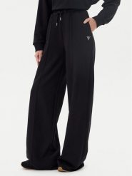 Guess Spodnie dresowe V5GB07 KCRP0 Czarny Regular Fit. Czarne spodnie dresowe damskie Guess, xs, z aplikacjami, z bawełny. Za 259.99 zł.