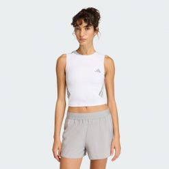 Koszulka adi365 Iconic Running Crop Tank. Białe koszulki sportowe damskie Adidas, bez wzorów, bez kołnierzyka, bez ramiączek. Za 129.00 zł.