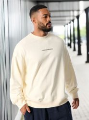 Bluza z napisem - kremowy. Białe bluzy męskie Sinsay, l, bez wzorów, bez kaptura. W wyprzedaży za 29.99 zł.