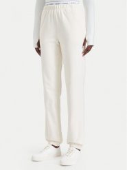 Guess Spodnie dresowe O5RB01 KCO31 Kremowy Regular Fit. Białe spodnie dresowe damskie Guess, xl, z aplikacjami, z bawełny. Za 264.99 zł.