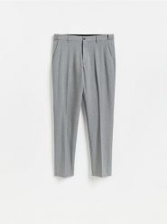 Garniturowe spodnie slim fit - ciemnoszary. Szare eleganckie spodnie męskie Reserved, l, bez wzorów, z tkaniny. Za 169.99 zł.