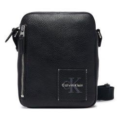 Saszetka Calvin Klein. Czarne saszetki męskie Calvin Klein, młodzieżowe, małe. Za 369.99 zł.