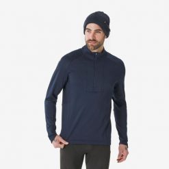 Koszulka termoaktywna narciarska męska Quechua BL 500 1/2 Zip. Niebieskie koszulki sportowe męskie WED'ZE, na zimę, l, bez wzorów, z elastanu, bez kołnierzyka, bez ramiączek, narciarskie. Za 89.99 zł.