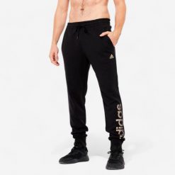 Spodnie męskie ADIDAS Gym & Pilates. Brązowe spodnie sportowe męskie Adidas, m, bez wzorów, z bawełny, na fitness i siłownię. Za 169.99 zł.