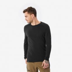 Koszulka z długim rękawem męska Forclaz MT500 merino. Czarne koszulki sportowe męskie FORCLAZ, l, bez wzorów, z materiału, bez kołnierzyka, bez ramiączek, trekkingowe. Za 229.99 zł.