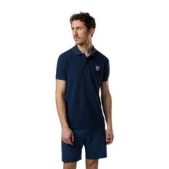 Polo Rossignol Classic. Niebieskie koszulki polo męskie Rossignol, m, bez wzorów, z bawełny, bez ramiączek. Za 406.50 zł.