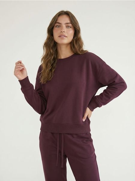 Dresowa bluza crewneck basic - fioletowy. Fioletowe bluzy damskie Sinsay, l, bez wzorów, z dresówki, bez kaptura. Za 35.99 zł.
