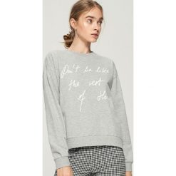 Bluza z hasłem - Jasny szar. Bluzy damskie marki KALENJI. W wyprzedaży za 19.99 zł.