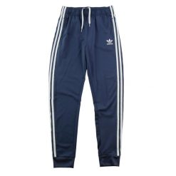 Spodnie dresowe męskie Adicolor SST Track Pants. Niebieskie spodnie sportowe męskie Adidas, m, bez wzorów, z dresówki, do biegania. Za 122.16 zł.