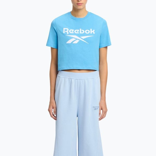 Koszulka Reebok Identity Big Logo Crop Tee. Niebieskie koszulki sportowe damskie REEBOK FITNESS, bez wzorów, sportowe, bez kołnierzyka. Za 59.99 zł.