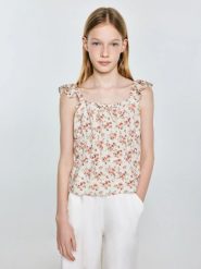 Bluzka dziewczęca z kwiatowym nadrukiem perłowa Weria 103. Białe bluzki dla dziewczynek Big Star, z aplikacjami, z wiskozy, bez kołnierzyka, bez ramiączek. Za 79.99 zł.