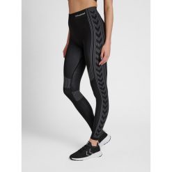 Damskie legginsy ze średnim stanem Hummel Shaping. Czarne legginsy damskie Hummel, xs, bez wzorów, z materiału. Za 128.00 zł.