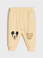 Spodnie z polarem w środku Mickey Mouse - kremowy. Białe spodenki niemowlęce Sinsay, bez wzorów, z jeansu. Za 11.99 zł.