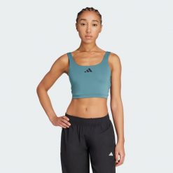 Koszulka Power Light Support Bra. Niebieskie obuwie sportowe damskie Adidas, bez wzorów, na fitness i siłownię. W wyprzedaży za 129.35 zł.