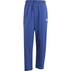 Spodnie dresowe z otwartym mankietem adidas Essentials Small Logo Stanford. Niebieskie spodnie sportowe męskie Adidas, uniwersalny, bez wzorów, z dresówki, do biegania. Za 177.85 zł.