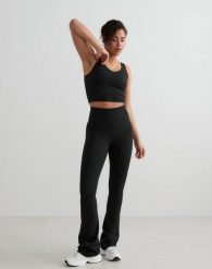 Damskie legginsy rozszerzane z wysokim stanem dla wysokich czarne. Czarne legginsy damskie Aim'n, l, bez wzorów, z elastanu. Za 344.00 zł.