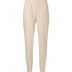 Damskie spodnie dresowe Athlecia Hecey. Białe obuwie sportowe damskie Athlecia, bez wzorów, z dresówki. Za 195.00 zł.