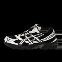 Damskie tenisówki Asics. Czarne trampki i tenisówki damskie Asics, bez wzorów, z materiału, eleganckie, bez zapięcia. Za 493.15 zł.