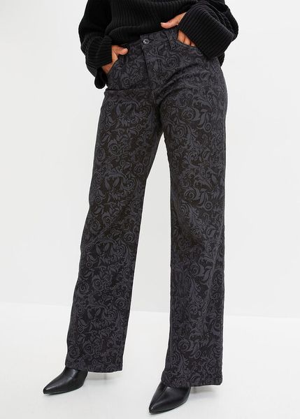 Dżinsy Marlena z połyskującym nadrukiem. Czarne jeansy damskie bonprix. Za 219.99 zł.
