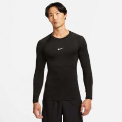 Koszulka Mężczyzna Nike Pro Dri-Fit czarny. Czarne koszulki sportowe męskie Nike, m, bez wzorów, bez kołnierzyka, bez ramiączek, do piłki nożnej, dri-fit (nike). Za 170.15 zł.