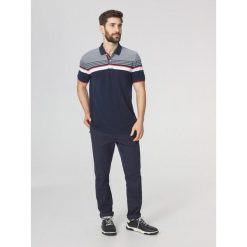 Koszulka polo męska TBS Eltonpol. Niebieskie koszulki polo męskie TBS, m, bez wzorów, bez kołnierzyka, bez ramiączek, żeglarskie. Za 329.00 zł.