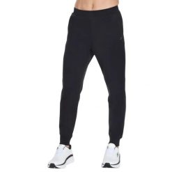 Spodnie sportowe męskie Skech-Knit Ultra Go Weekend Jogger. Czarne spodnie sportowe męskie Skechers, l, bez wzorów, z bawełny, na fitness i siłownię. Za 219.99 zł.