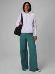 4F Spodnie dresowe z szerokimi nogawkami damskie - turkusowe XS. Niebieskie spodnie dresowe damskie 4f, s, bez wzorów, z bawełny. Za 149.99 zł.