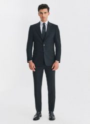 PAKO LORENTE - Wełniany czarny garnitur męski. Czarne spodnie materiałowe męskie Pako Lorente, m, bez wzorów, z wełny, biznesowe. Za 2,499.98 zł.