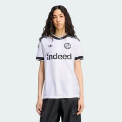 Koszulka wyjazdowa Eintracht Frankfurt 26/27. Białe koszulki sportowe damskie Adidas, m, bez wzorów, z dzianiny, bez kołnierzyka, bez ramiączek, do piłki nożnej, climacool (adidas). Za 439.00 zł.