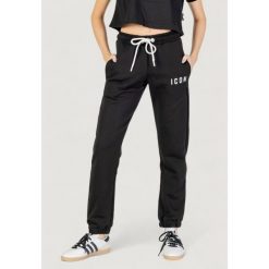 Spodnie Kobieta ICON. Czarne spodnie sportowe damskie ICON, bez wzorów. W wyprzedaży za 284.50 zł.
