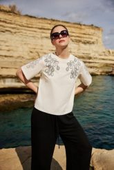 Bawełniana bluzka z nardukiem biała. Białe bluzki damskie MOODO, l, bez wzorów, z bawełny, bez kołnierzyka, bez ramiączek. Za 59.99 zł.